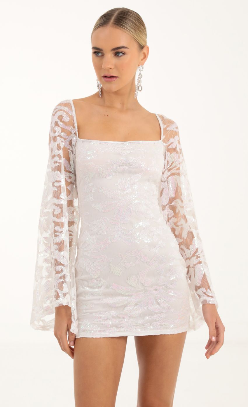 Picture Elly Tulle Iridescent Sequin Flare Sleeve Dress in White. Source: https://media.lucyinthesky.com/data/Oct22/850xAUTO/f0a89b09-d096-4f90-a47b-c58b5c5d0330.jpg