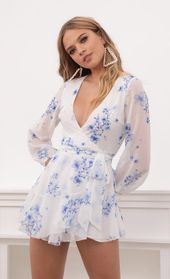 Picture thumb Lexi Ruffle Wrap Dress in Blue Floral. Source: https://media.lucyinthesky.com/data/Sep20_1/170xAUTO/781A6486.JPG