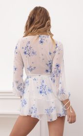 Picture thumb Lexi Ruffle Wrap Dress in Blue Floral. Source: https://media.lucyinthesky.com/data/Sep20_1/170xAUTO/781A6555.JPG