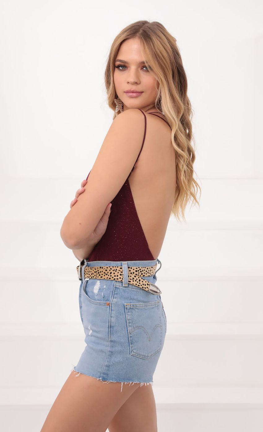 Picture One Shoulder Shimmer Bodysuit in Burgundy. Source: https://media.lucyinthesky.com/data/Sep20_1/850xAUTO/781A0513.JPG