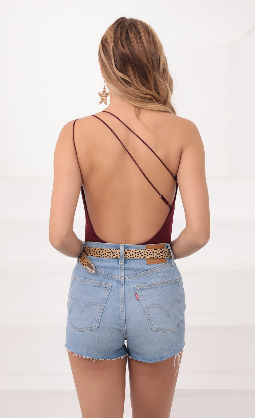 Picture One Shoulder Shimmer Bodysuit in Burgundy. Source: https://media.lucyinthesky.com/data/Sep20_1/850xAUTO/781A05181.JPG