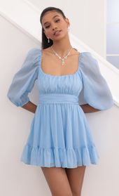 Picture thumb Neia Ruffle Dress in Blue Sparkly Chiffon. Source: https://media.lucyinthesky.com/data/Sep20_2/170xAUTO/781A0252.JPG