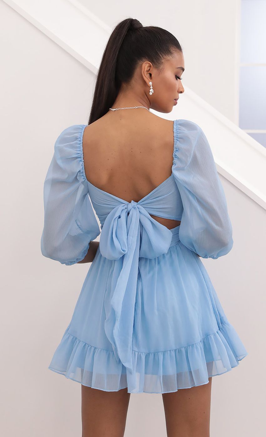 Picture Neia Ruffle Dress in Blue Sparkly Chiffon. Source: https://media.lucyinthesky.com/data/Sep20_2/850xAUTO/781A0357.JPG