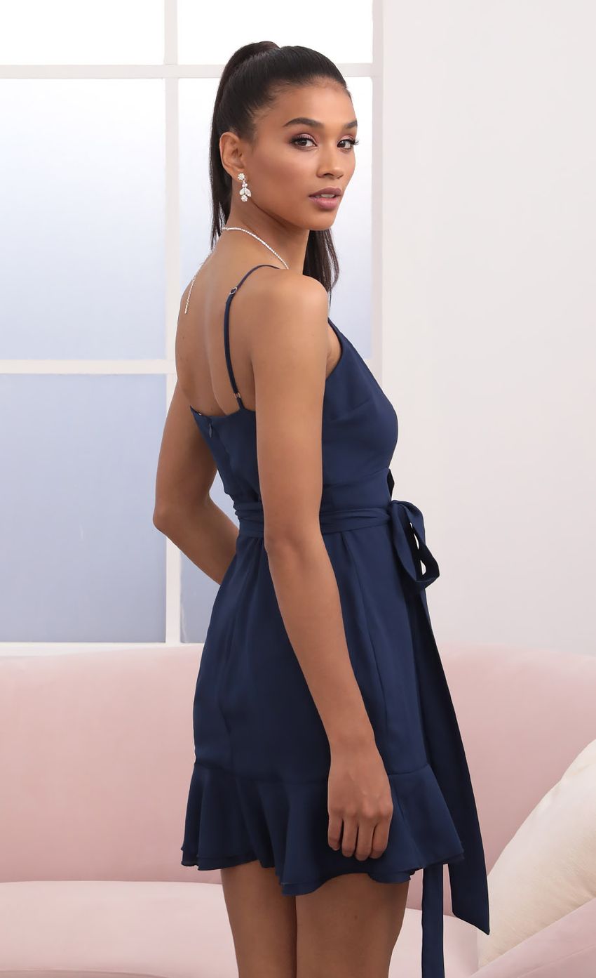 Picture Becca Wrap Ruffle Dress in Navy. Source: https://media.lucyinthesky.com/data/Sep20_2/850xAUTO/781A0529.JPG