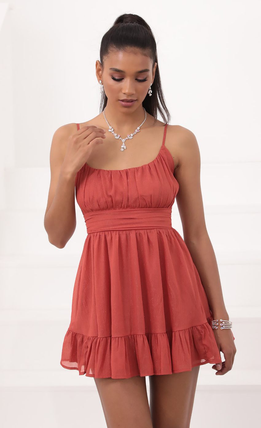 Picture Molly Ruffled Chiffon Dress in Rust. Source: https://media.lucyinthesky.com/data/Sep20_2/850xAUTO/781A0631.JPG