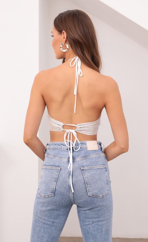 Picture Tali Iridescent Sequin Halter Top in White. Source: https://media.lucyinthesky.com/data/Sep21_1/500xAUTO/1V9A6972.JPG