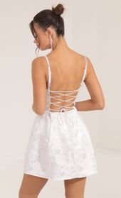 Picture thumb Siena Floral Jacquard Corset Dress in White. Source: https://media.lucyinthesky.com/data/Sep22/170xAUTO/fd692649-ccc3-4ce2-9e7d-4ec41bd5fcd9.jpg