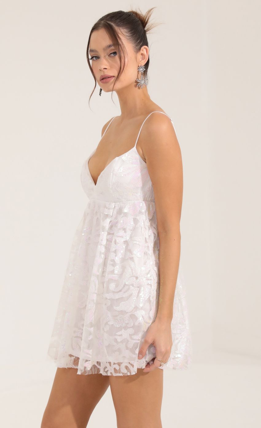 Picture Kami Sequin Tulle Baby Doll Dress in White. Source: https://media.lucyinthesky.com/data/Sep22/850xAUTO/9283475b-70d3-49d4-9f35-4dc0e0773109.jpg