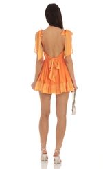 Picture Azarliah Ruffle Dress in Orange. Source: https://media.lucyinthesky.com/data/Sep23/150xAUTO/6dfe0dd1-009e-4e93-b7e5-3823c637510d.jpg