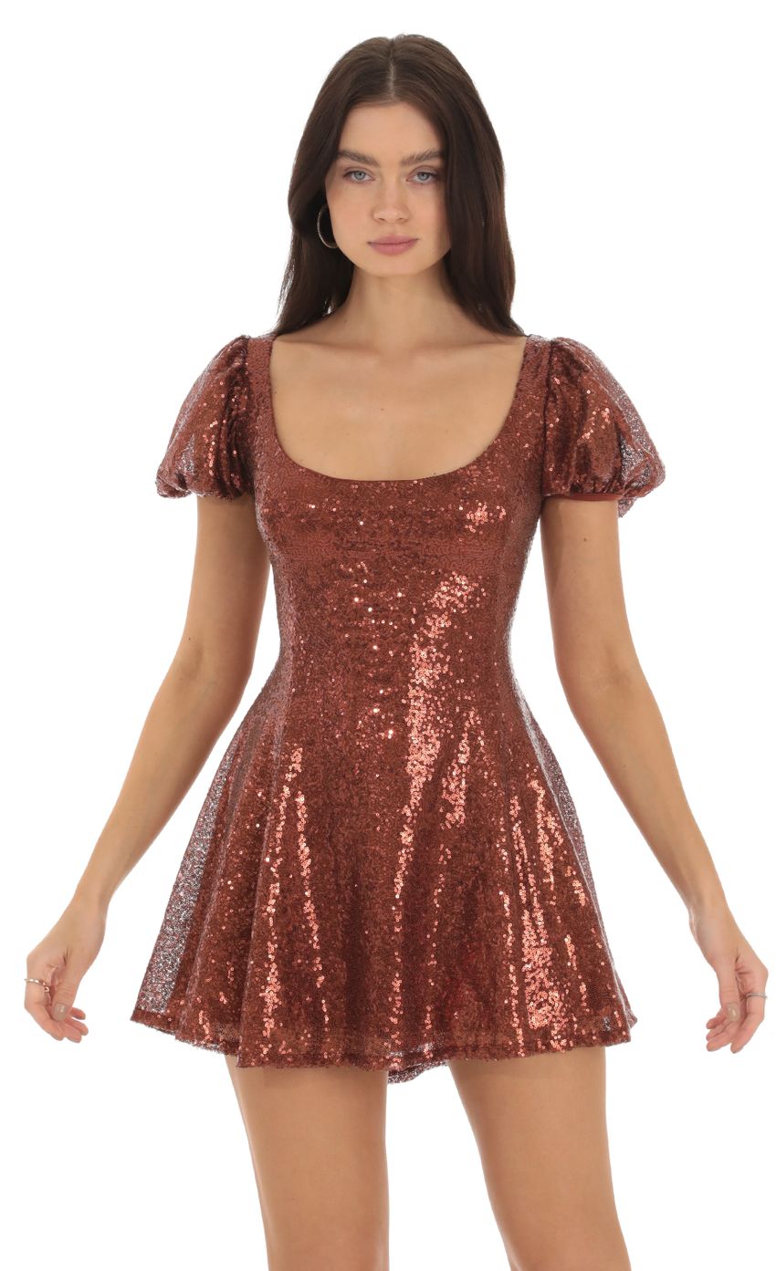 Picture Wannda Sequin Puff Sleeve Dress in Brown. Source: https://media.lucyinthesky.com/data/Sep23/850xAUTO/15722c60-8d95-49bf-964a-c744921365f6.jpg