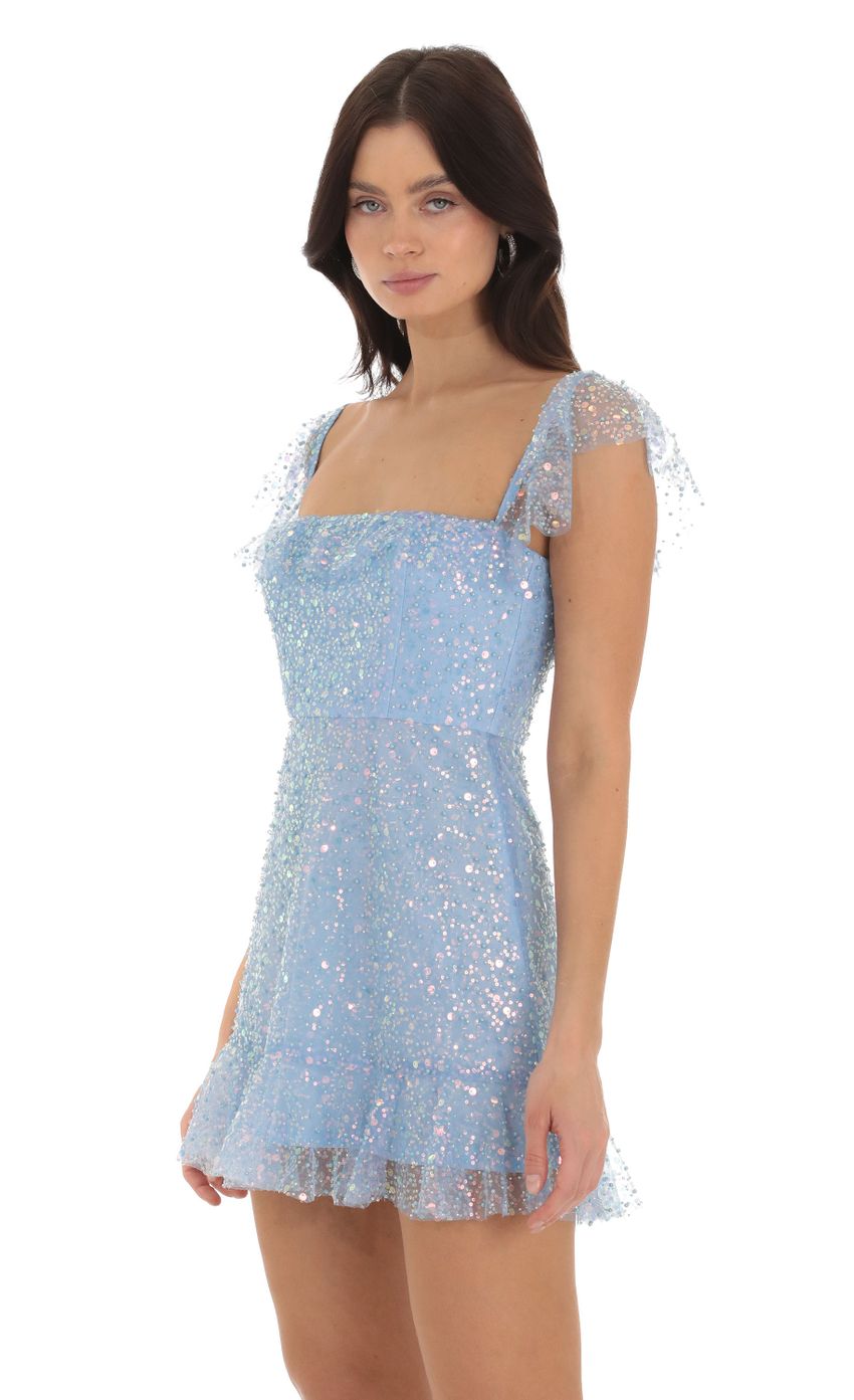 Picture Celosia Sequin Ruffle Dress in Blue. Source: https://media.lucyinthesky.com/data/Sep23/850xAUTO/3498495b-fd91-405c-ba68-35a45d6f168a.jpg