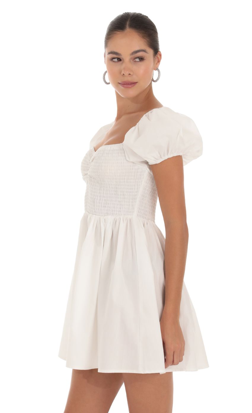 Picture Maceline Puff Sleeve Dress in White. Source: https://media.lucyinthesky.com/data/Sep23/850xAUTO/587e5023-70de-4e40-8039-a5af46840e4a.jpg