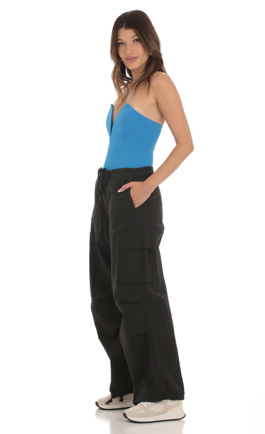 Picture Acacia Cargo Pants in Black. Source: https://media.lucyinthesky.com/data/Sep23/850xAUTO/674af74b-55d1-46fb-a78b-89f817edee63.jpg
