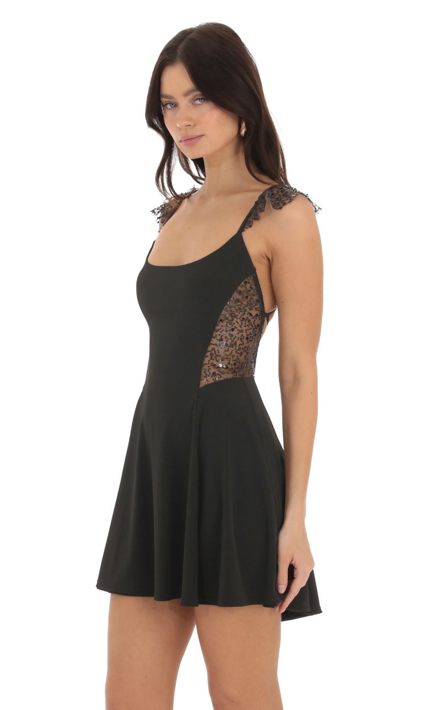 Picture Thalassa Sequin A-line Dress in Black. Source: https://media.lucyinthesky.com/data/Sep23/850xAUTO/bf875200-a49e-4947-8a4f-8db7d3efc31b.jpg