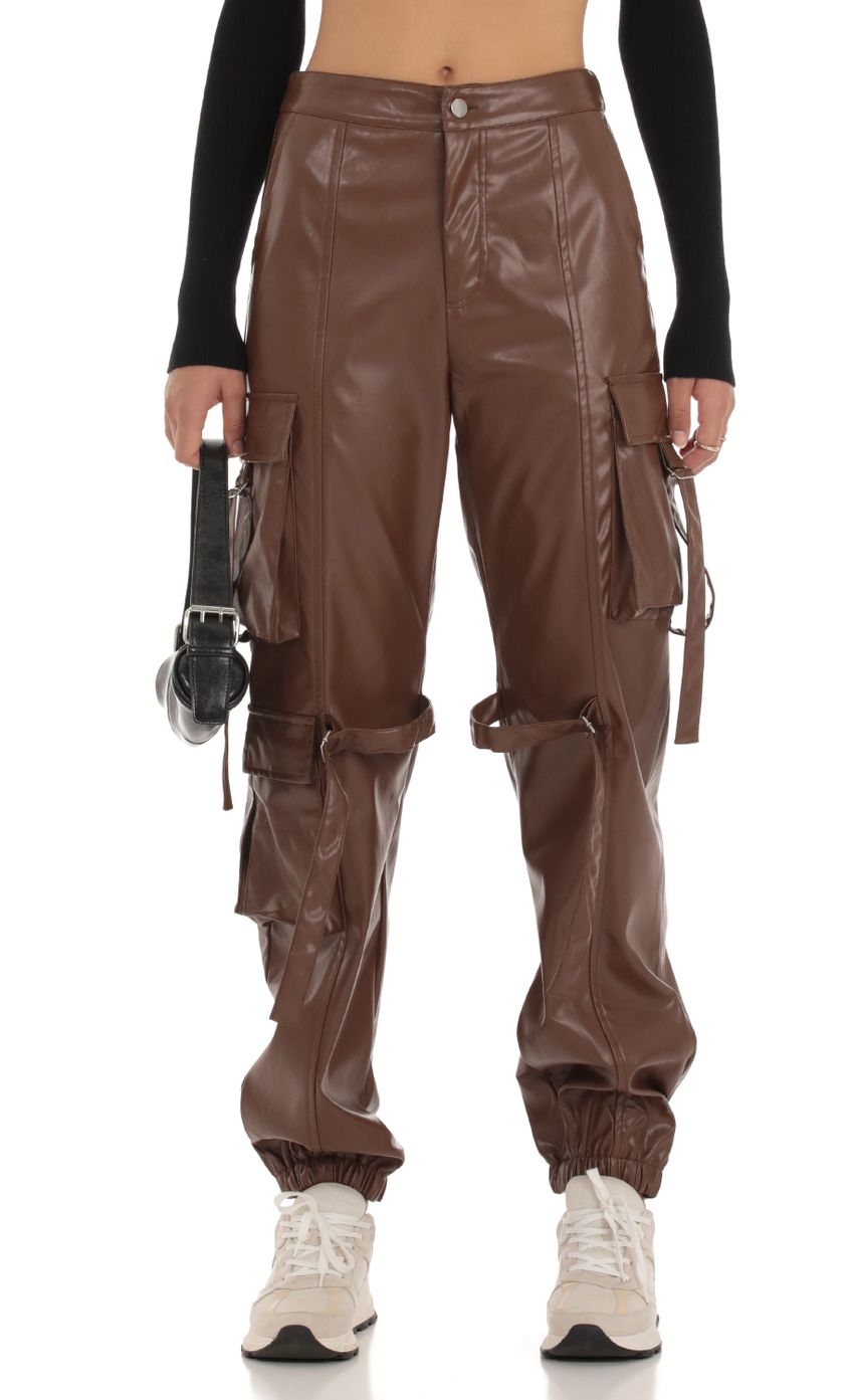 Picture Jai Pleather Cargo Pants in Brown. Source: https://media.lucyinthesky.com/data/Sep23/850xAUTO/cd61be78-f50f-4e02-84b8-a5113a1e723c.jpg